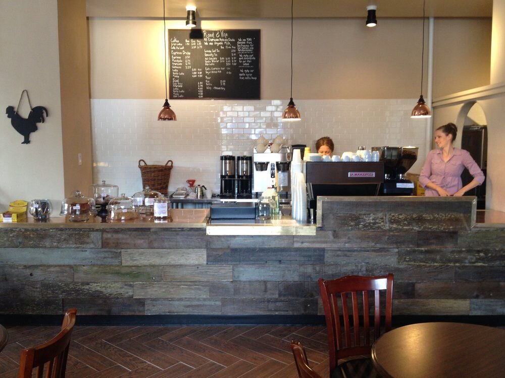 A London cafe counter with coffee and pastries